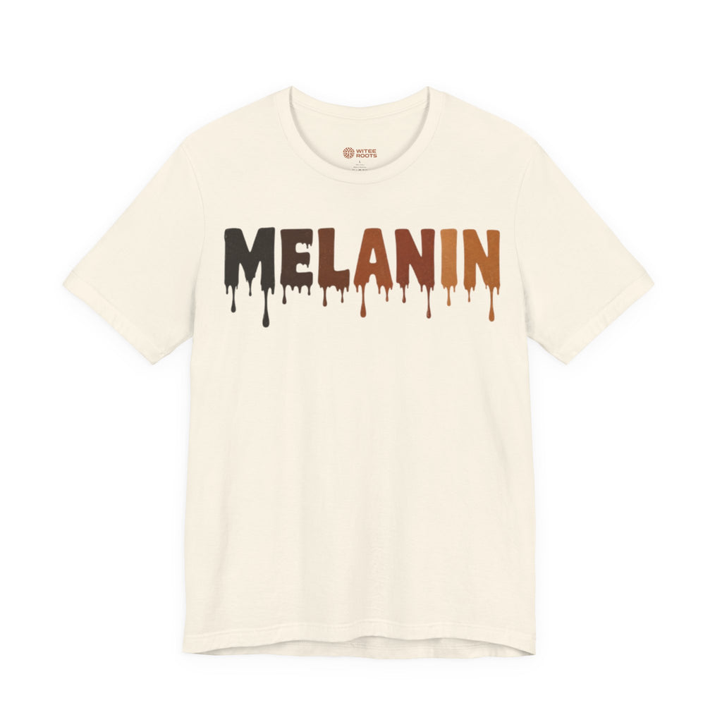 An off-white short-sleeve t-shirt with the word 'MELANIN' printed across the chest in a dripping paint style, transitioning from black to brown to orange. The brand name 'WITEE ROOTS' is visible on the inner neck label.