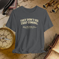 Gray t-shirt with 'They Didn't See That Coming' text on a vintage map background