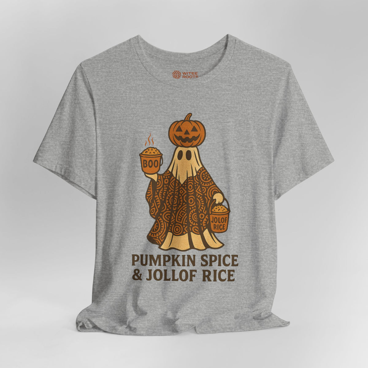A heather gray t-shirt featuring a cartoon ghost in a patterned orange and brown robe with a jack-o'-lantern on its head, holding a cup of pumpkin spice and a bucket of jollof rice. The text 'PUMPKIN SPICE & JOLLOF RICE' is printed below in brown.