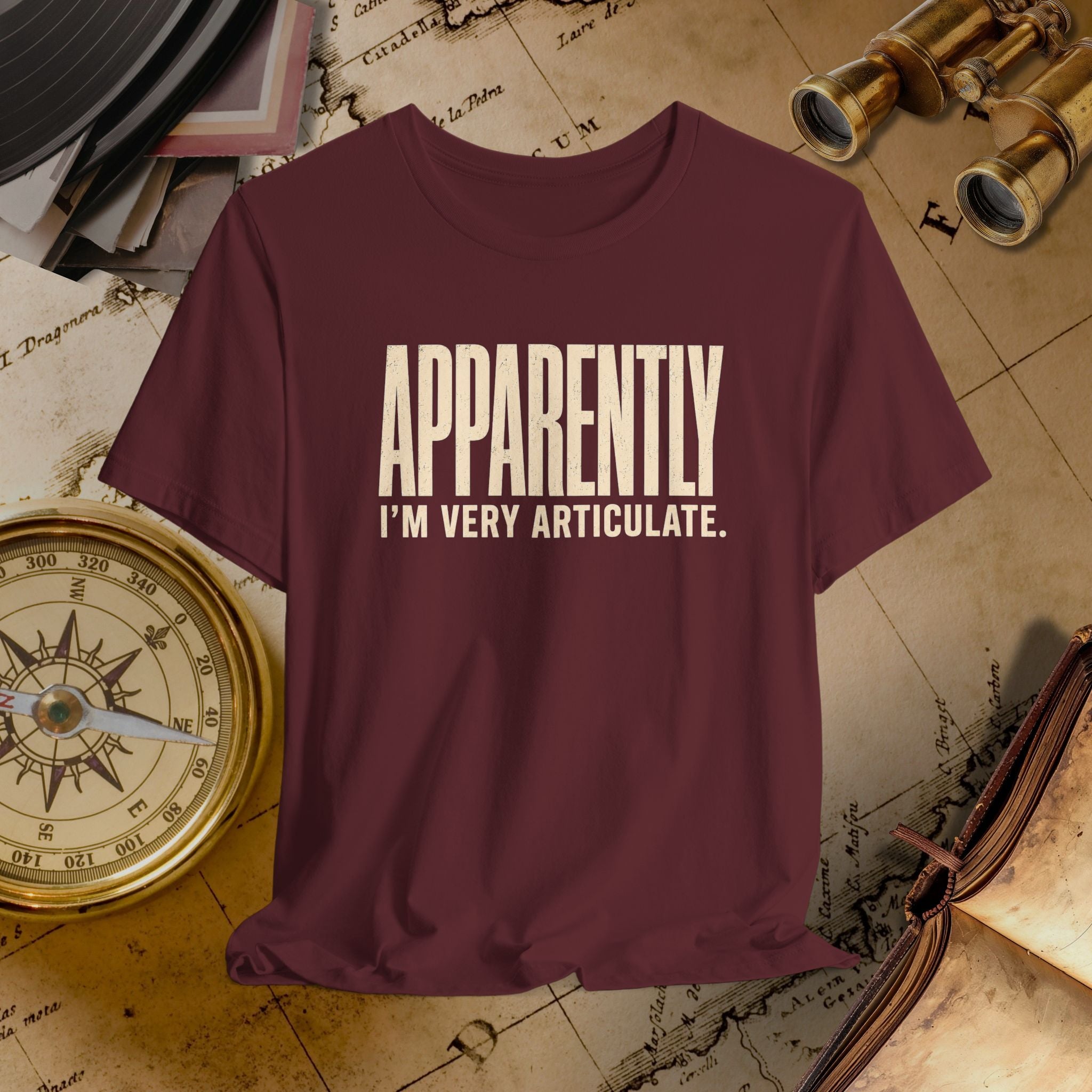 Maroon t-shirt with 'APPROACHETLY I'M VERY ARTICULATE' text on a vintage map background