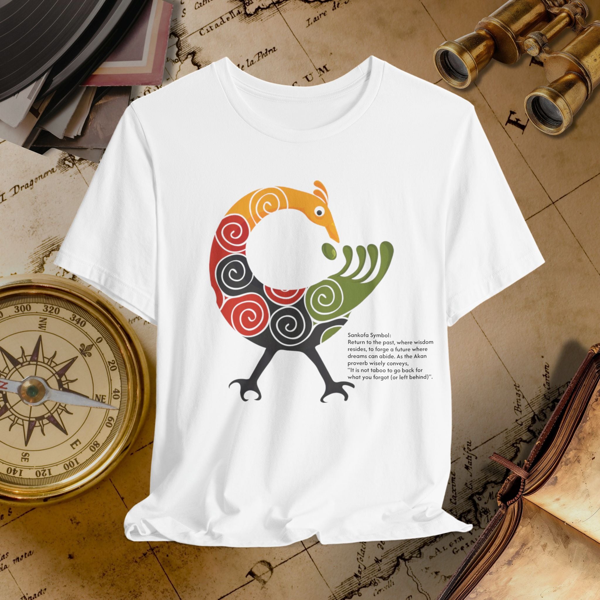 White t-shirt with a colorful bird design on a vintage map background