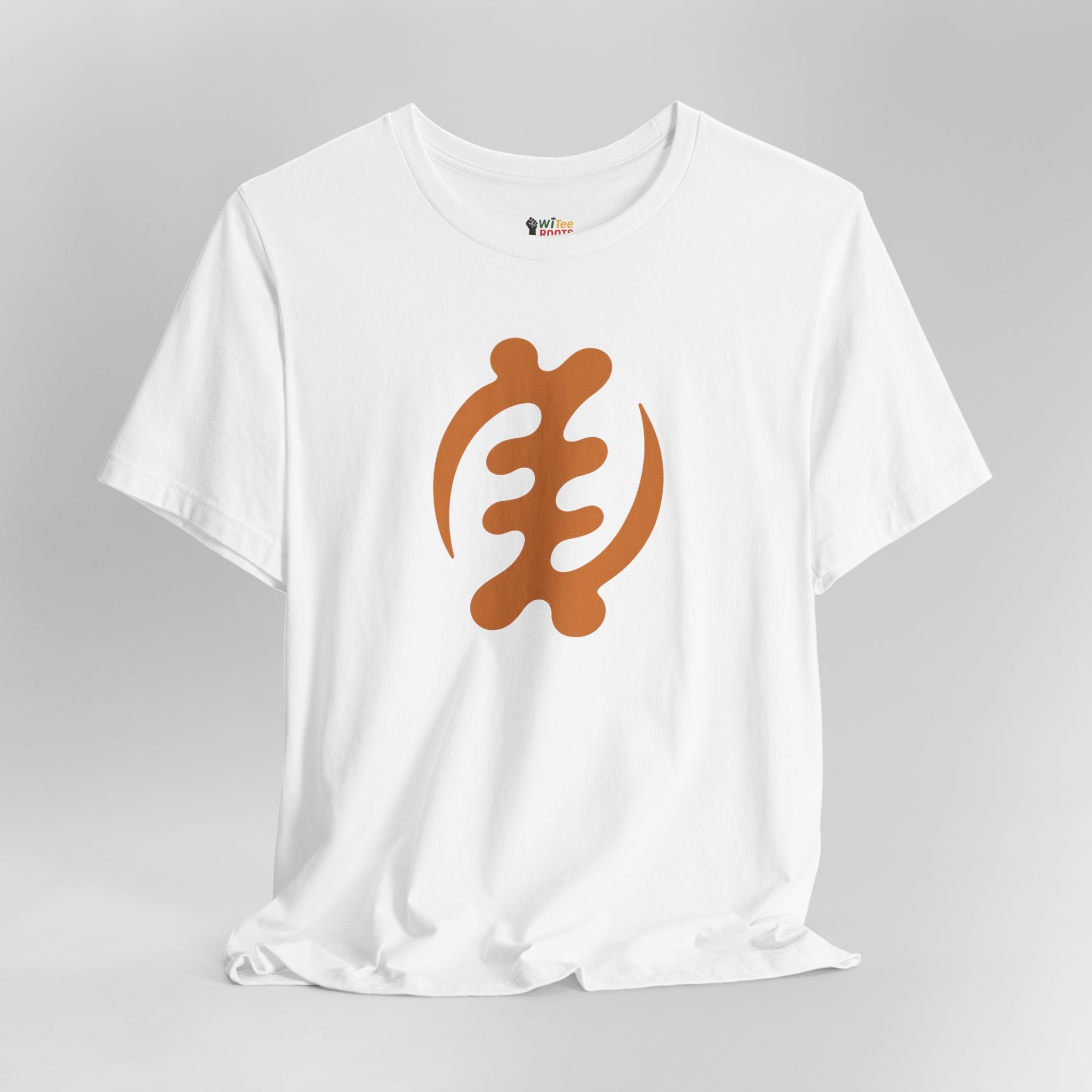 White t-shirt with a brown graphic design on a gray background