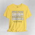 Yellow t-shirt with motivational quote on a gray background