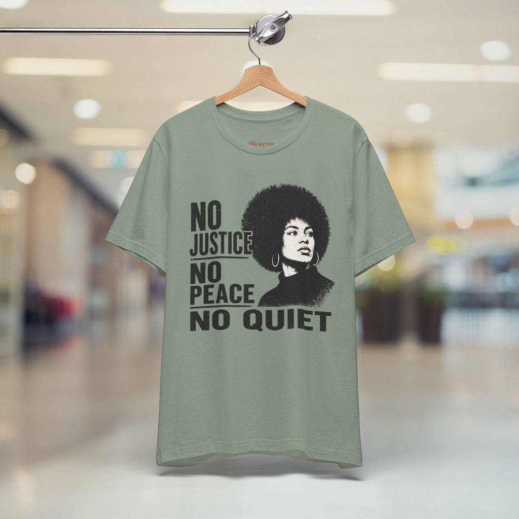 Green t-shirt with a graphic and text on a hanger in a store setting