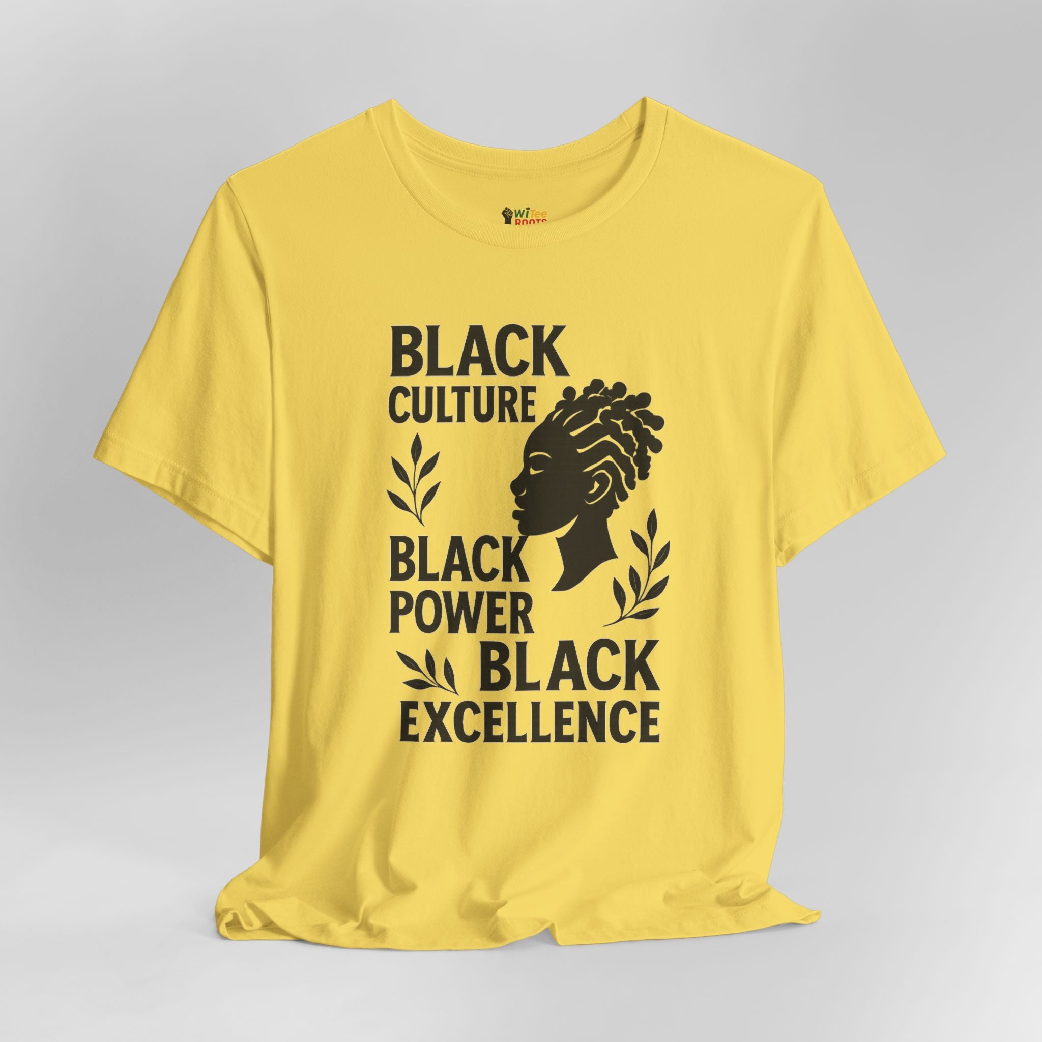 Yellow t-shirt with black text and graphic on a gray background