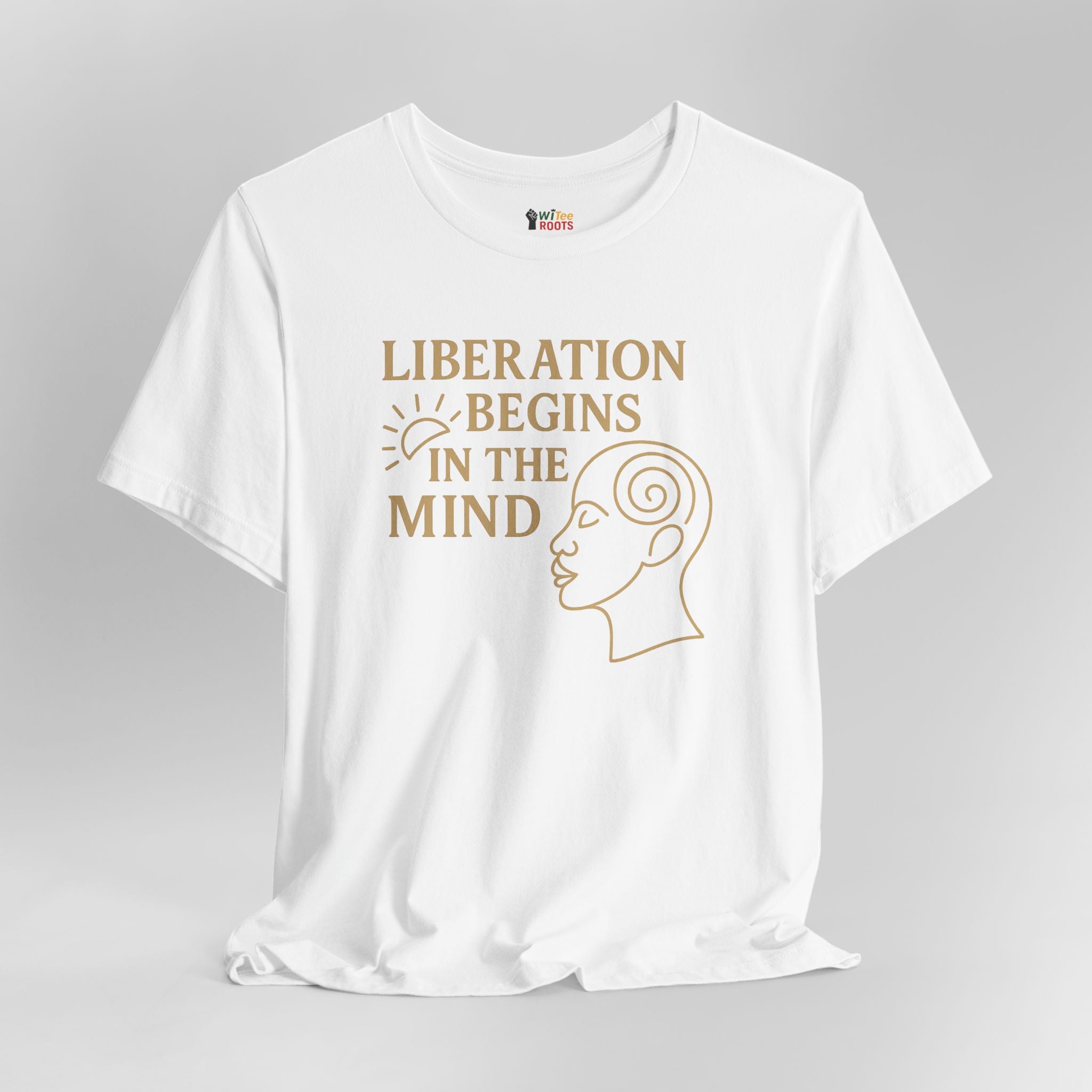 White t-shirt with gold text and graphic on a gray background