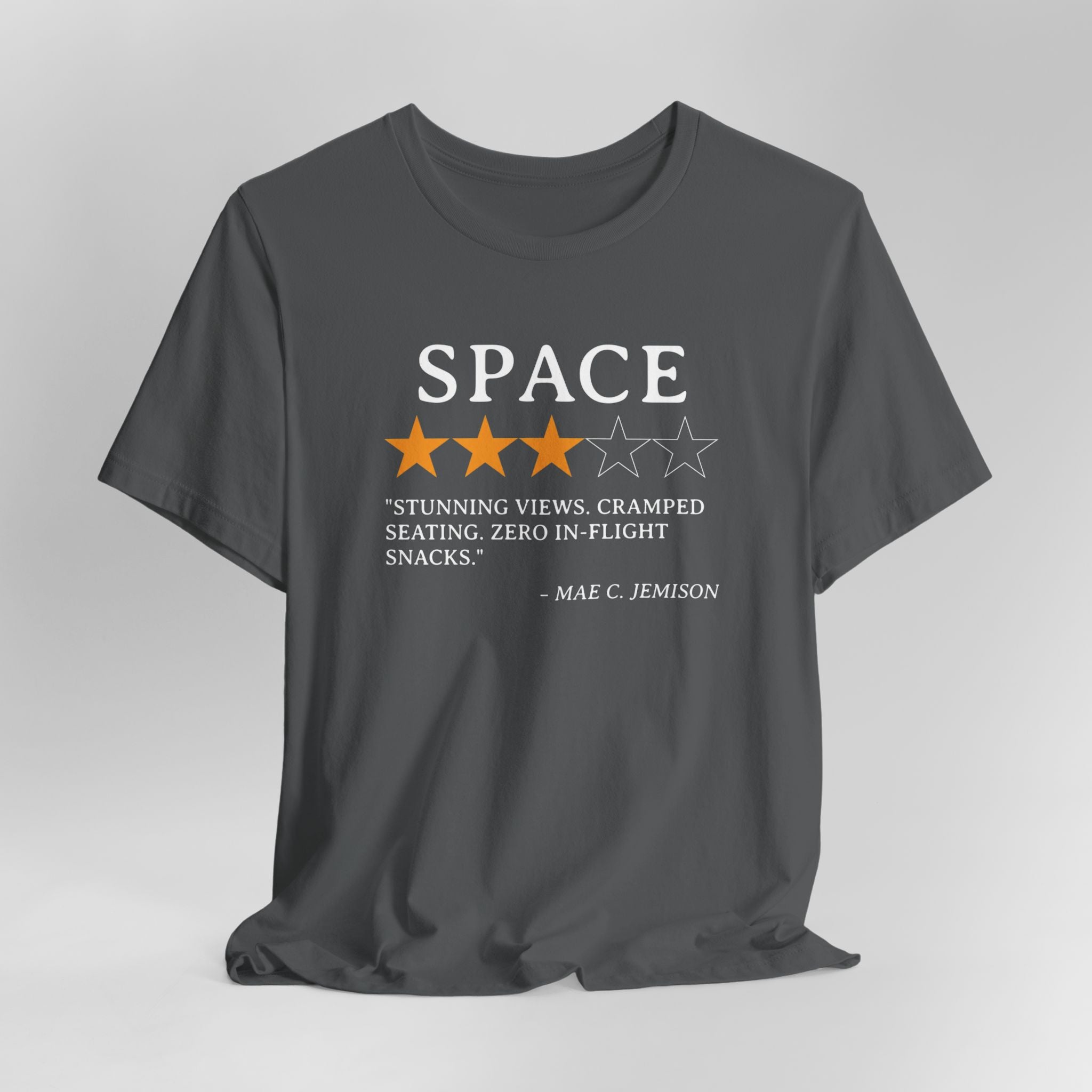 Gray t-shirt with space-themed graphic and text on a gray background