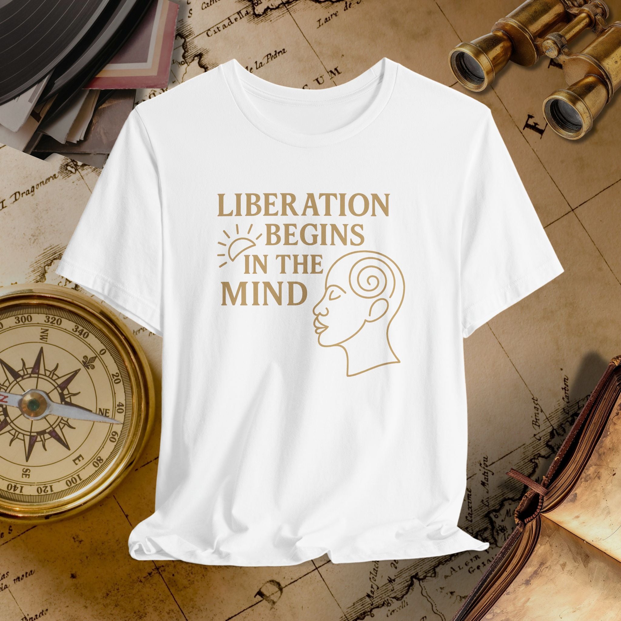 White t-shirt with 'Liberation Begins in the Mind' text and graphic on a vintage background
