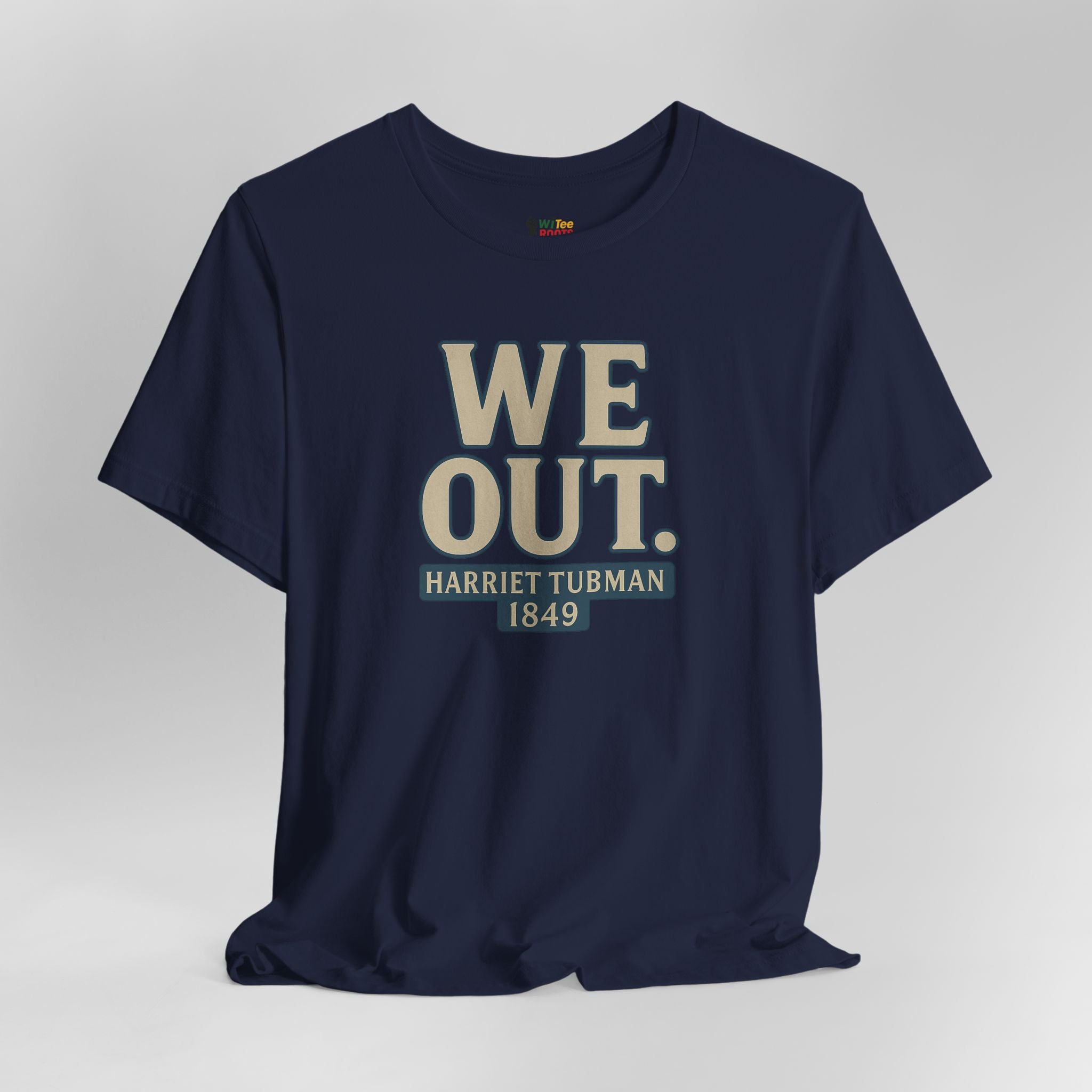 Navy blue t-shirt with 'WE OUT. HARRIET TUBMAN 1849' text on a gray background
