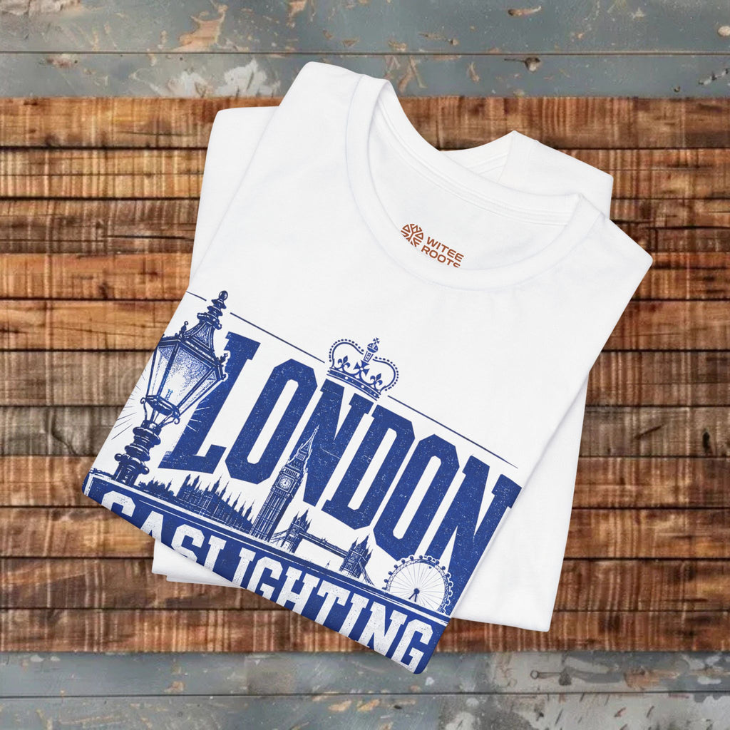 White t-shirt with blue 'London' design on a wooden surface