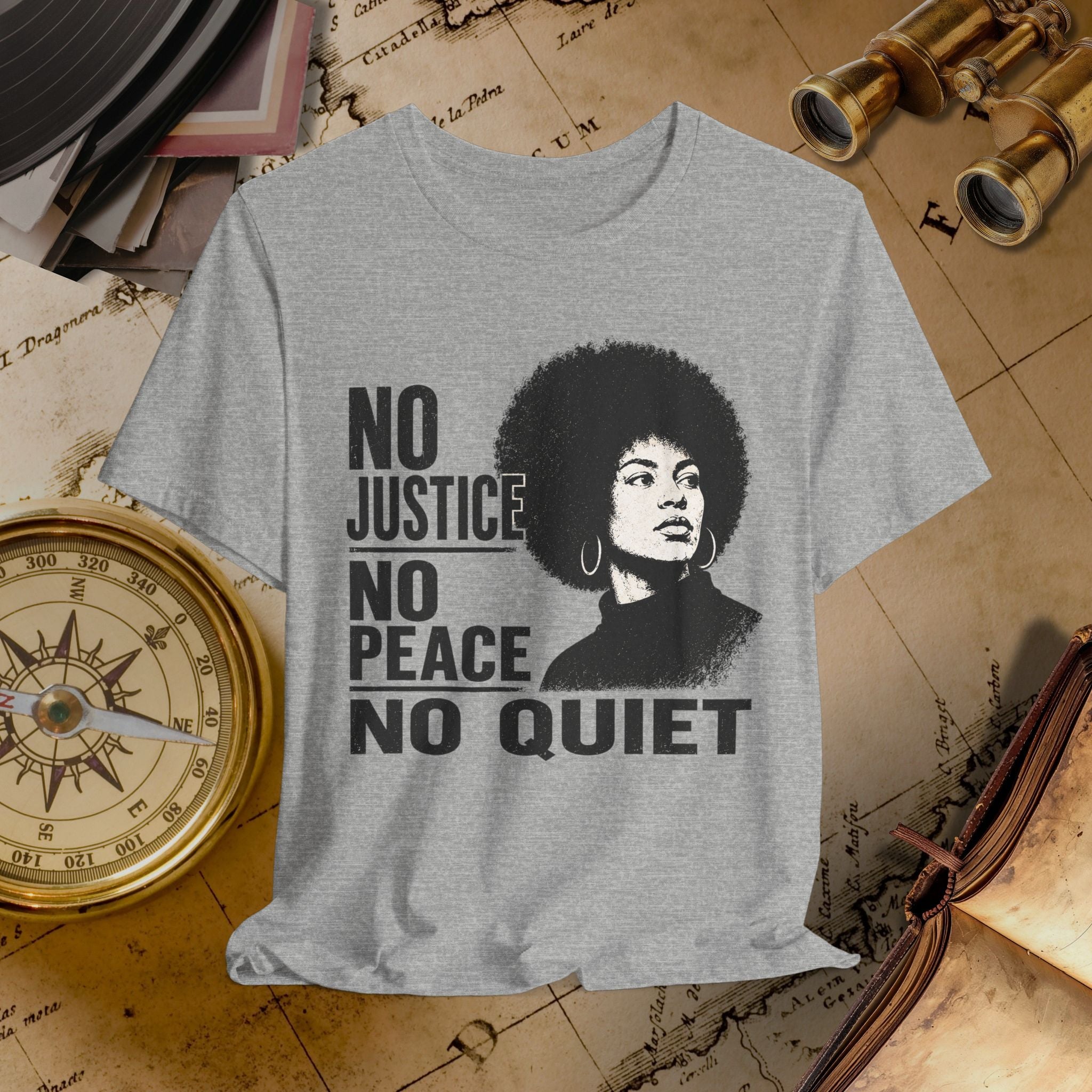 Gray t-shirt with a graphic of a woman with an afro and text 'No Justice No Peace No Quiet' on a vintage map background.