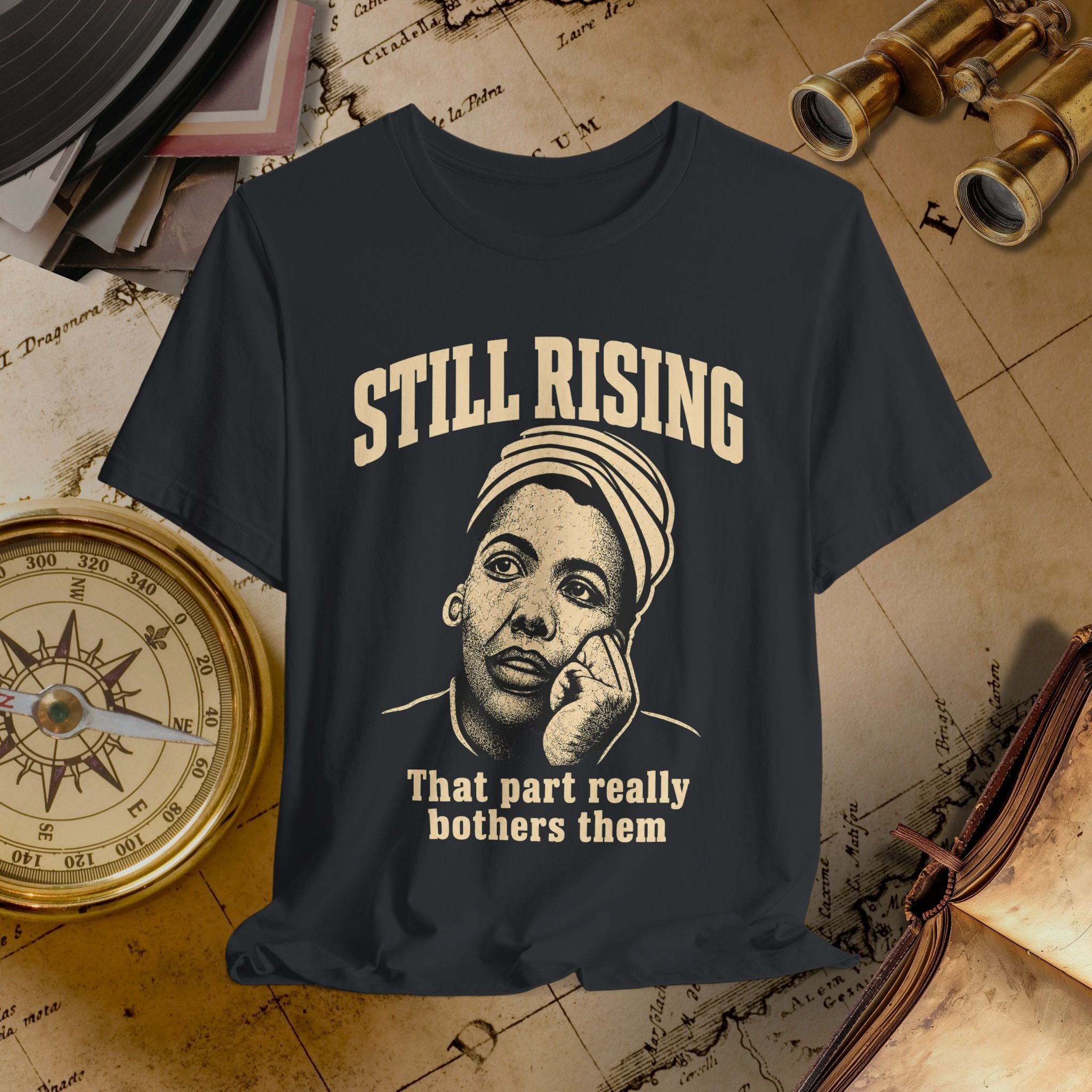 Black t-shirt with graphic and text on a vintage map background