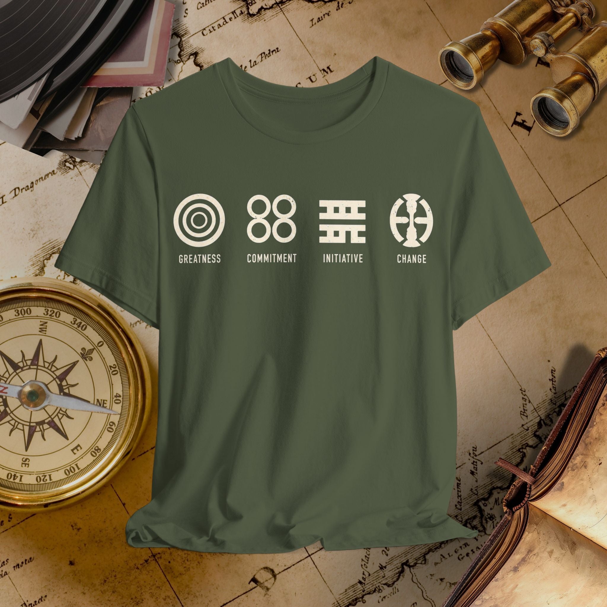 Green t-shirt with motivational symbols and text on a vintage map background