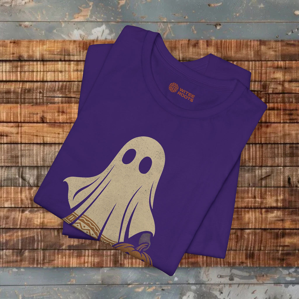 Folded purple t-shirt with a ghost graphic on a wooden surface