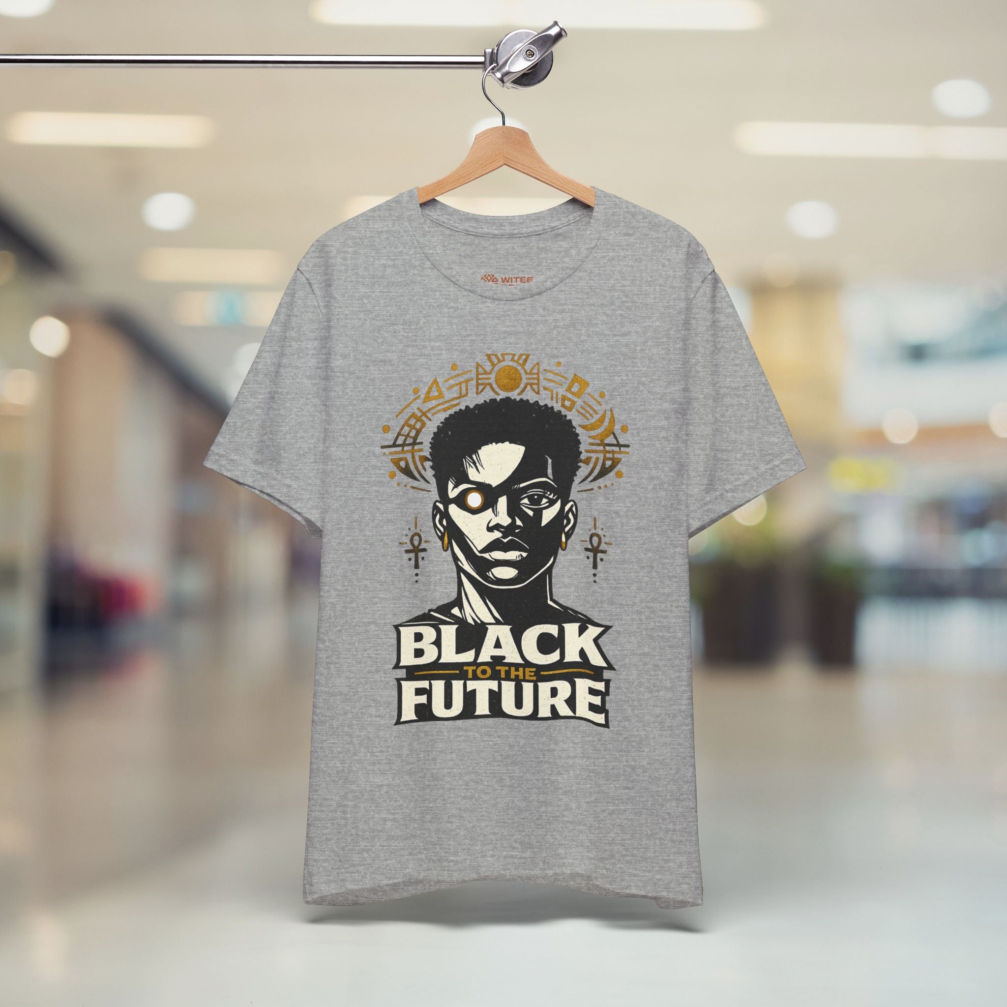 Gray t-shirt with 'Black to the Future' design on a hanger in a store.