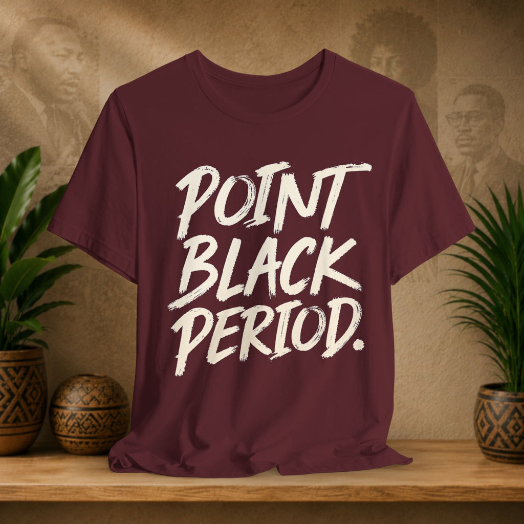 A maroon short-sleeve t-shirt with the phrase 'POINT BLACK PERIOD.' printed in large white brush-style lettering across the front.