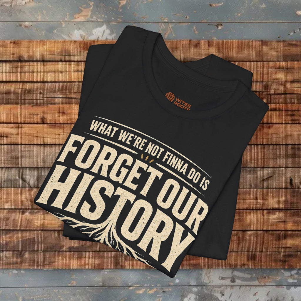 Black t-shirt with 'Forget Our History' text on a wooden surface