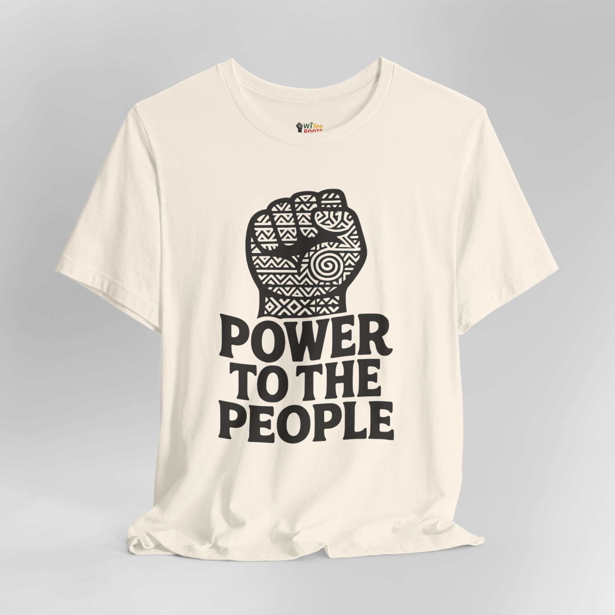 Beige t-shirt with a black fist graphic and 'Power to the People' text on a gray background