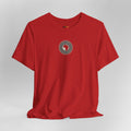 Red t-shirt with a circular design on a gray background