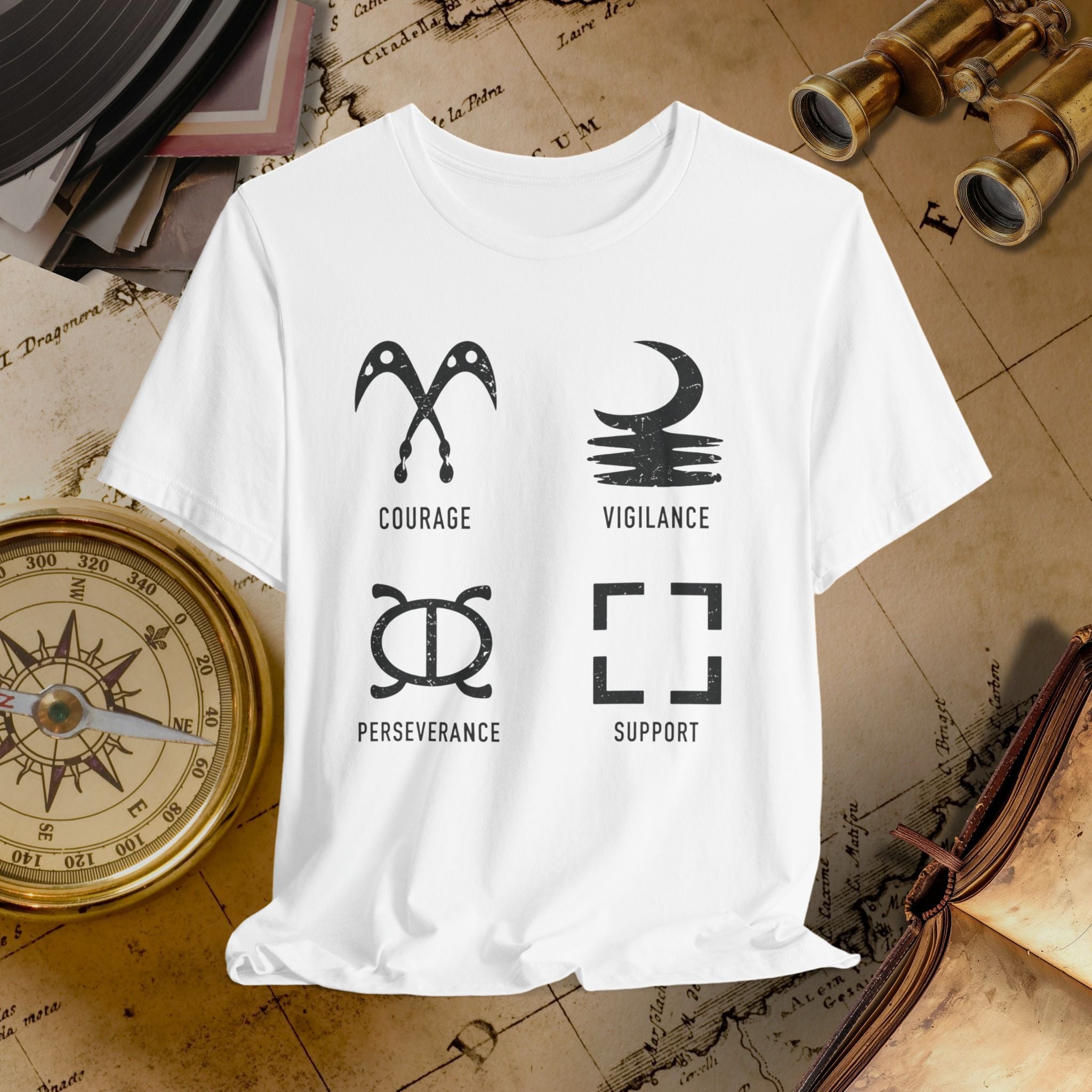 White t-shirt with black symbols and text on a vintage map background