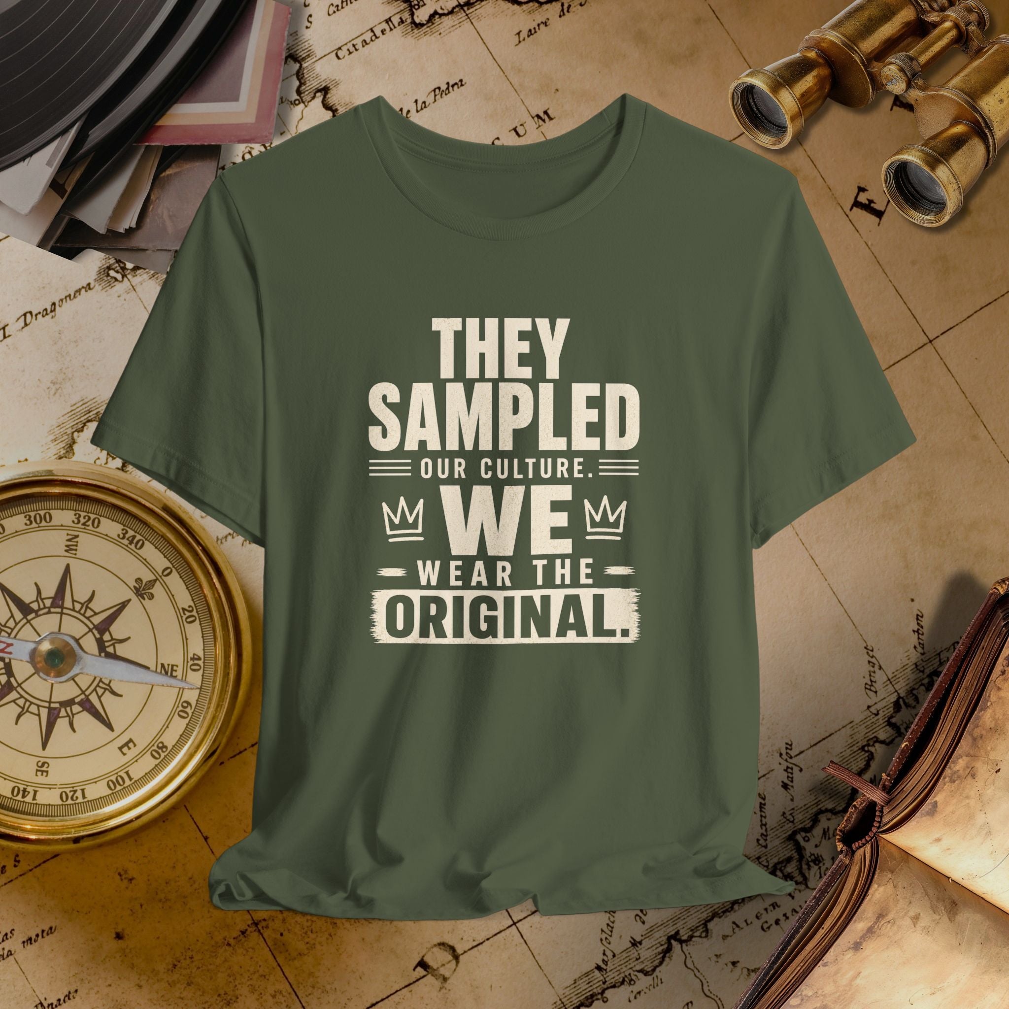 Green t-shirt with white text on a vintage map background