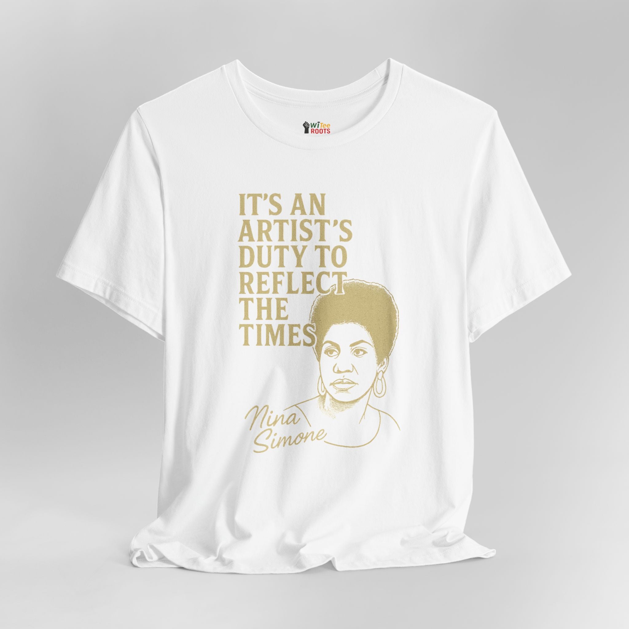 White t-shirt with gold text and Nina Simone's portrait on a gray background