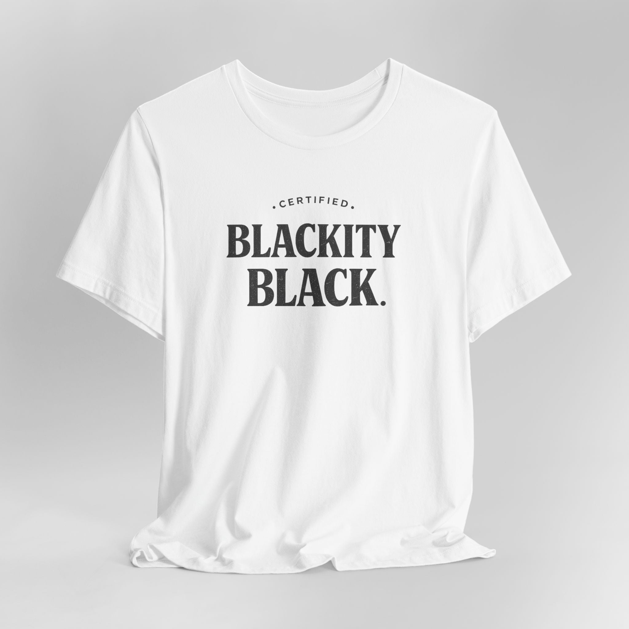 White t-shirt with 'CERTIFIED BLACKITY BLACK' text on a gray background