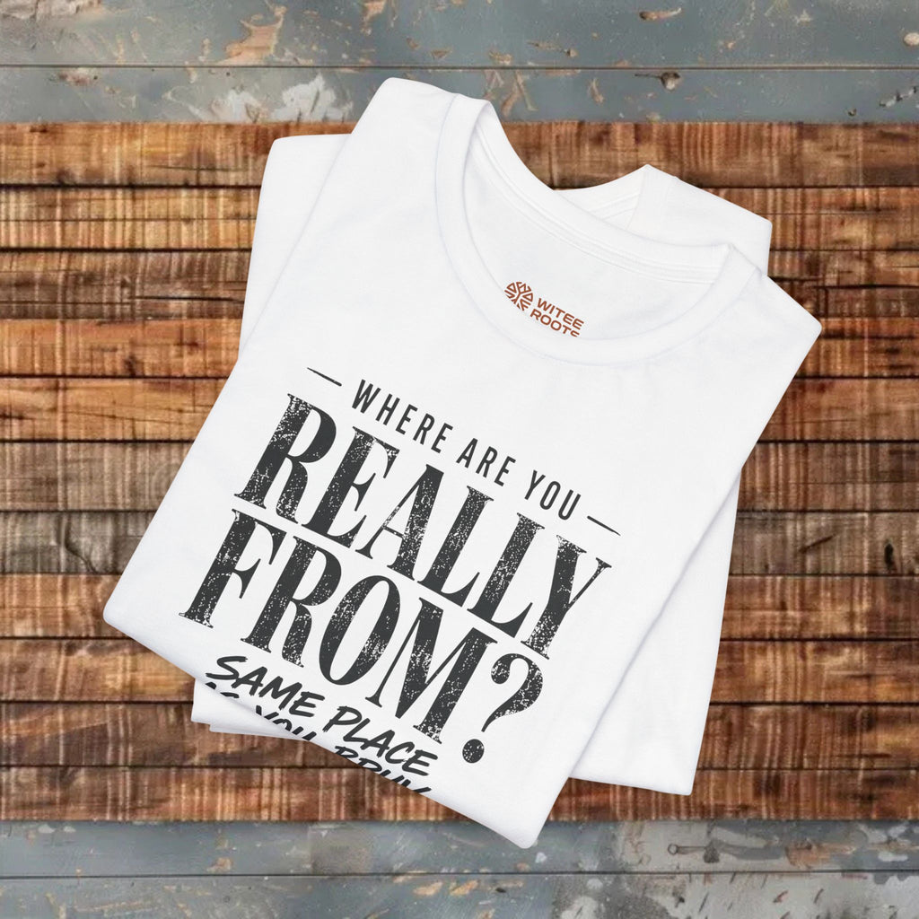 White t-shirt with text design on a wooden surface