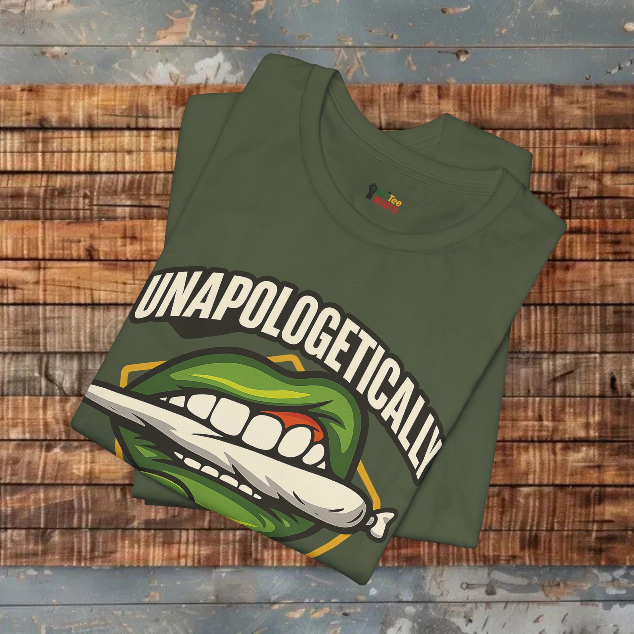 Green t-shirt with graphic design and text on a wooden surface