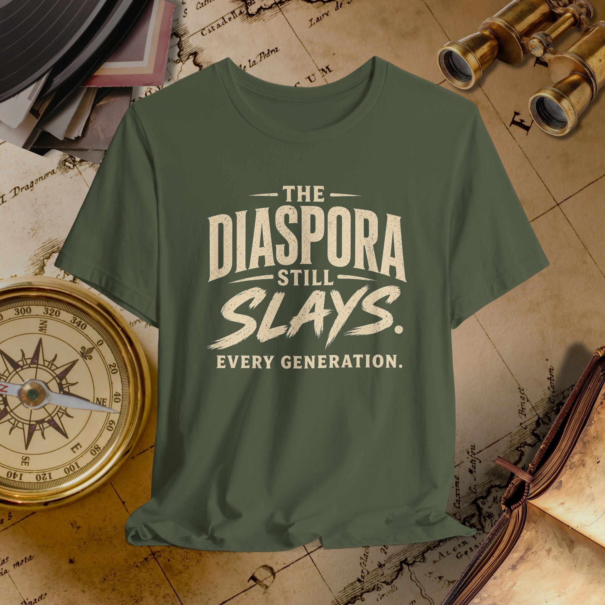 Green t-shirt with 'The Diaspora Still Slays Every Generation' text on a vintage map background.
