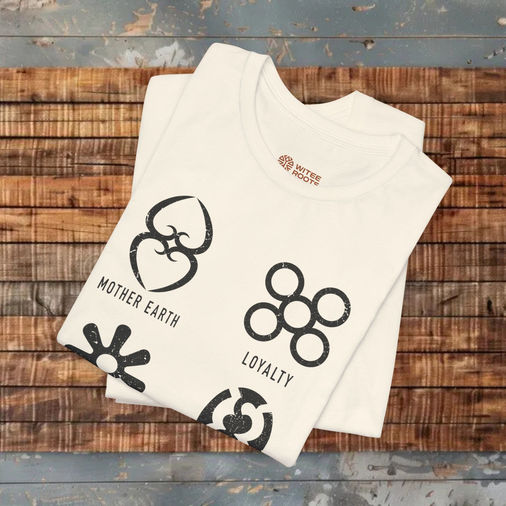 Sand t-shirt with black graphics and text on a wooden surface
