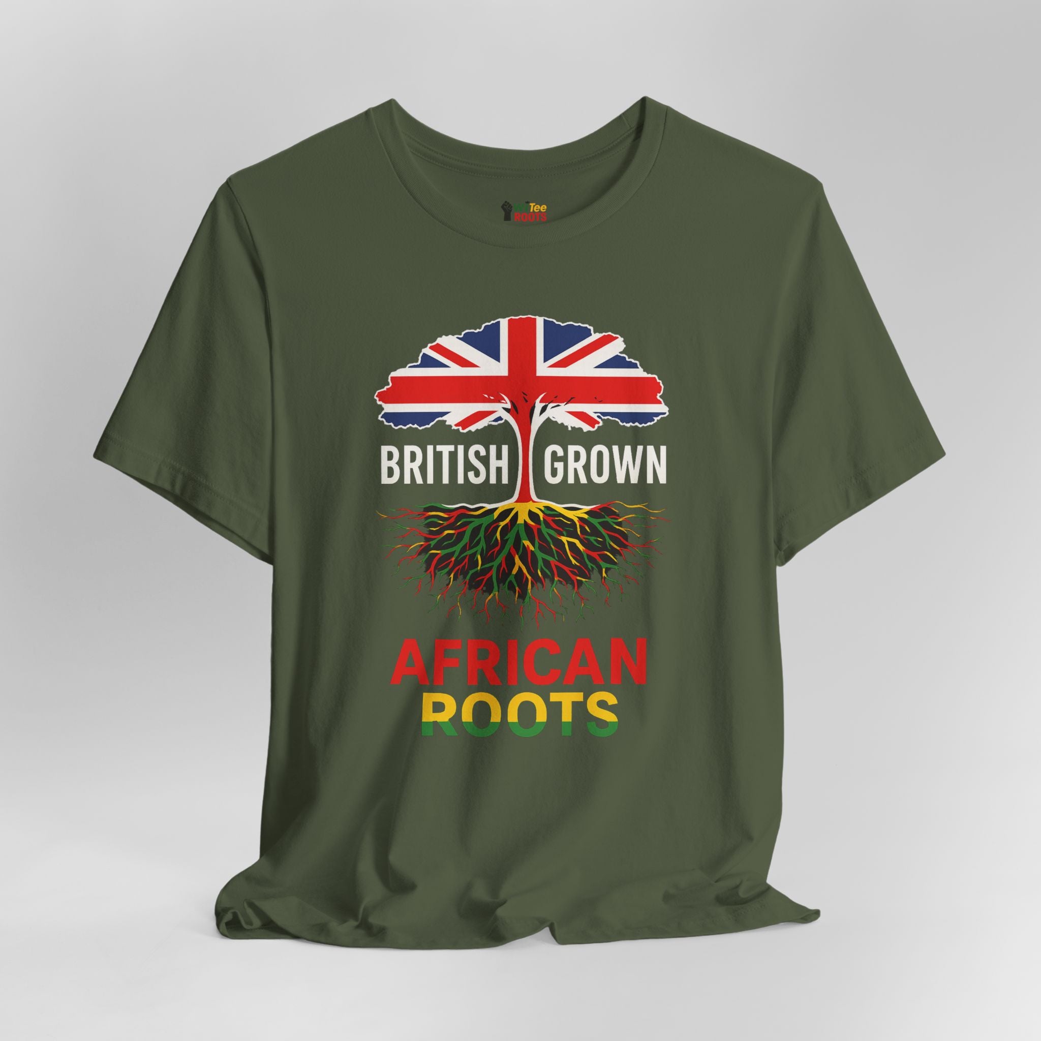 Green t-shirt with a design of a tree with roots and British flag, text 'British Grown African Roots' on a gray background.