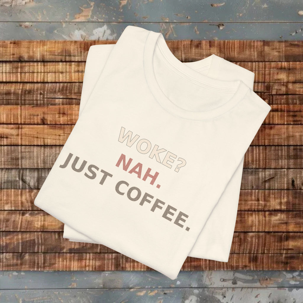 Beige t-shirt with humorous text on a wooden surface