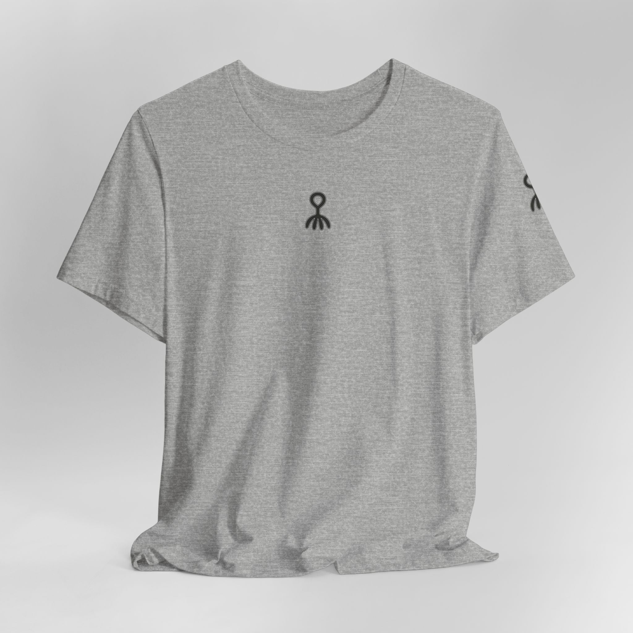 Gray t-shirt with floral design and text 'let go & bloom' on a light gray background