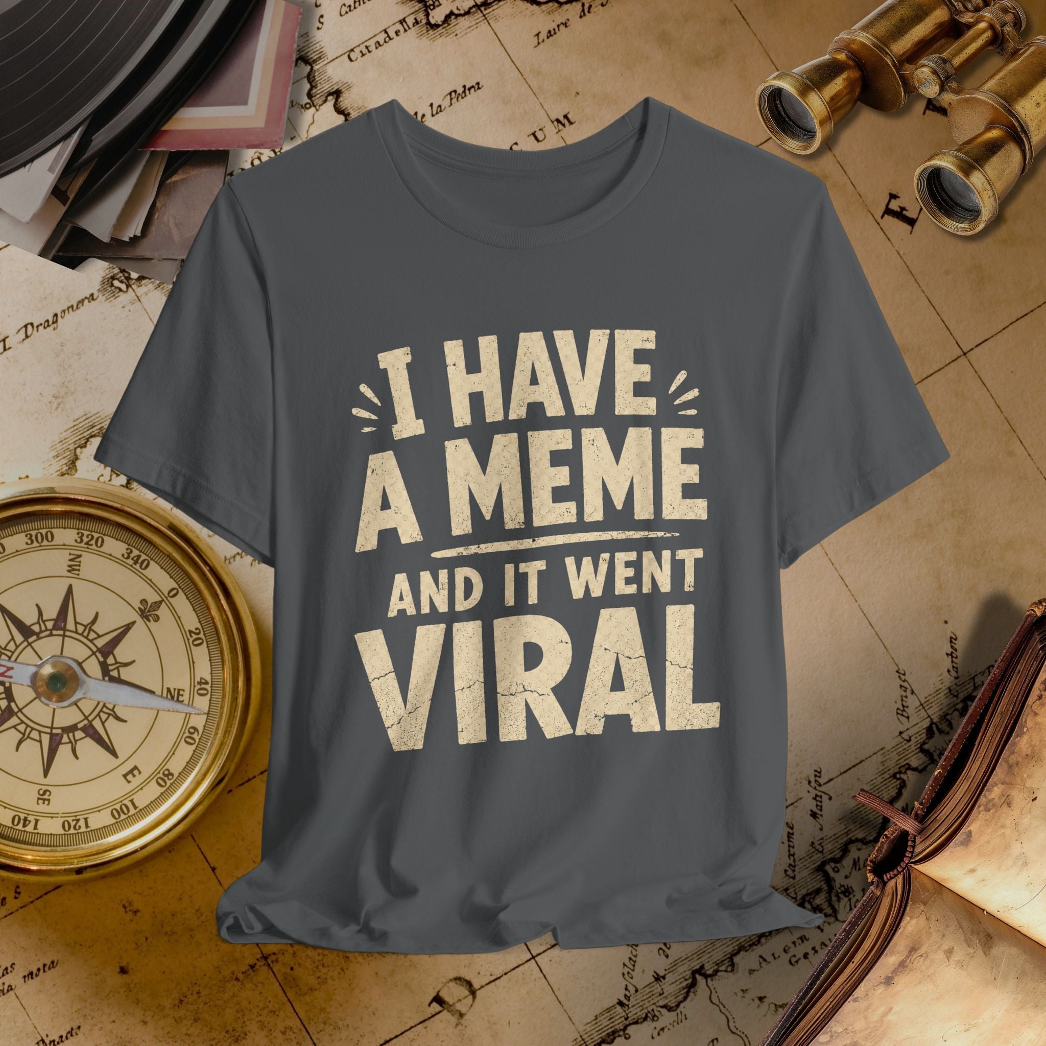 Gray t-shirt with 'I have a meme and it went viral' text on a vintage map background