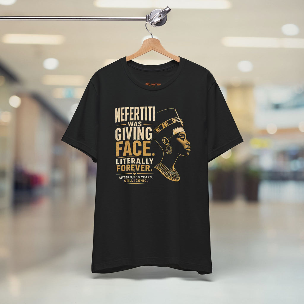 Black t-shirt with gold text and graphic of a woman on a hanger in a store.