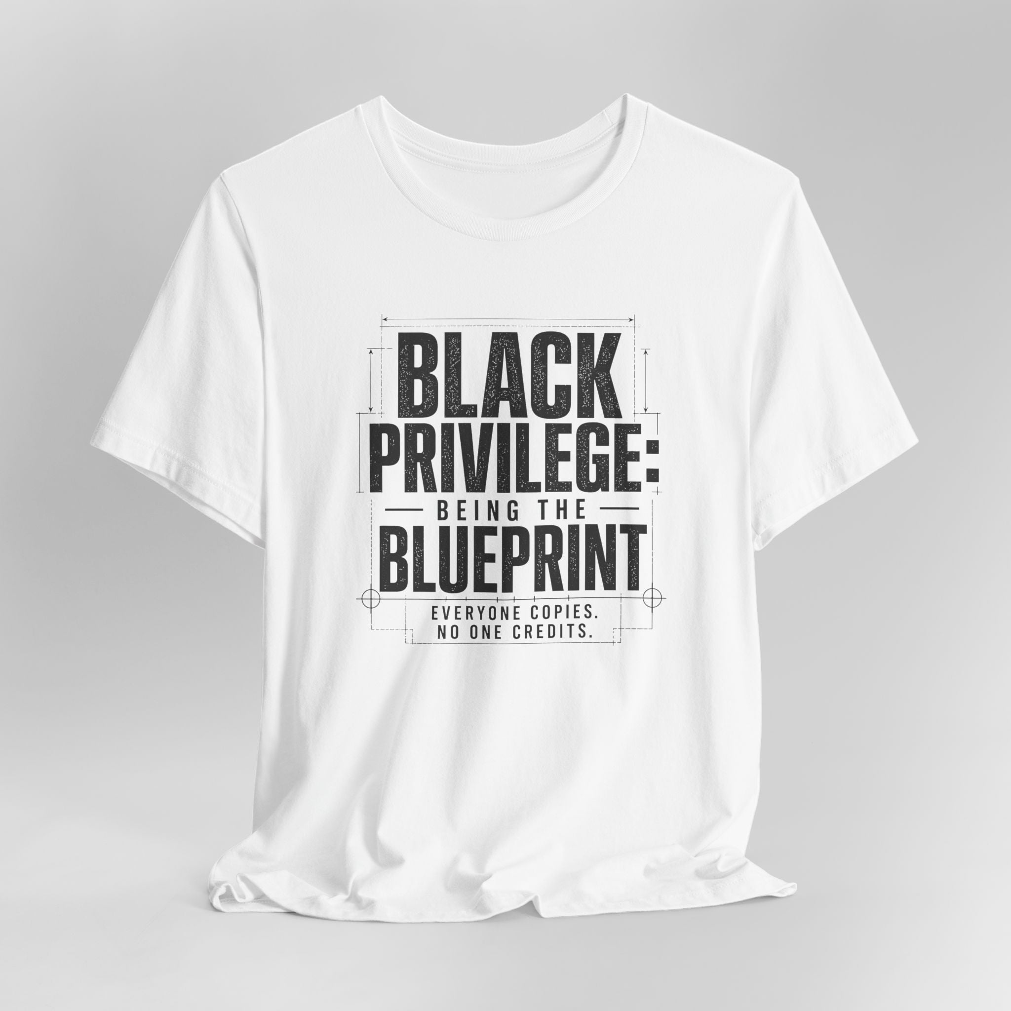 White t-shirt with black text on a gray background