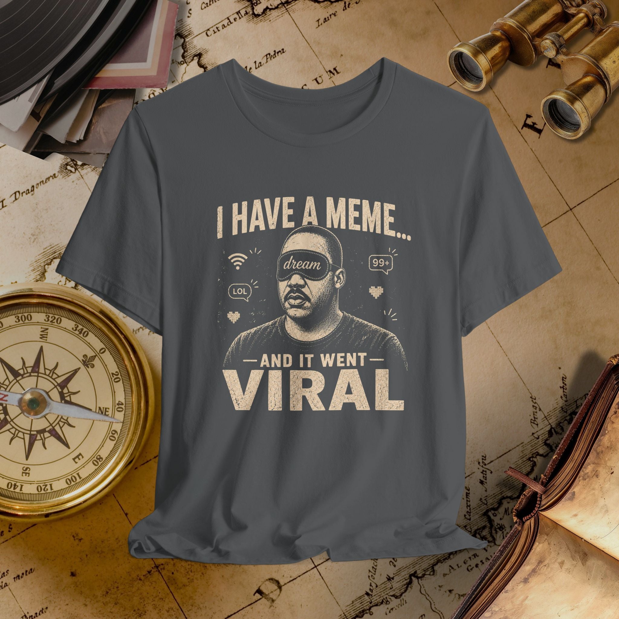 Gray t-shirt with graphic and text on a vintage map background