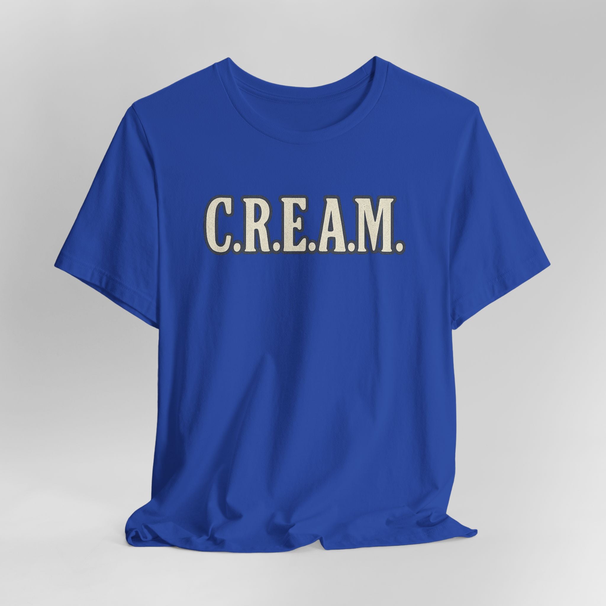 Blue t-shirt with 'C.R.E.A.M.' text on a gray background