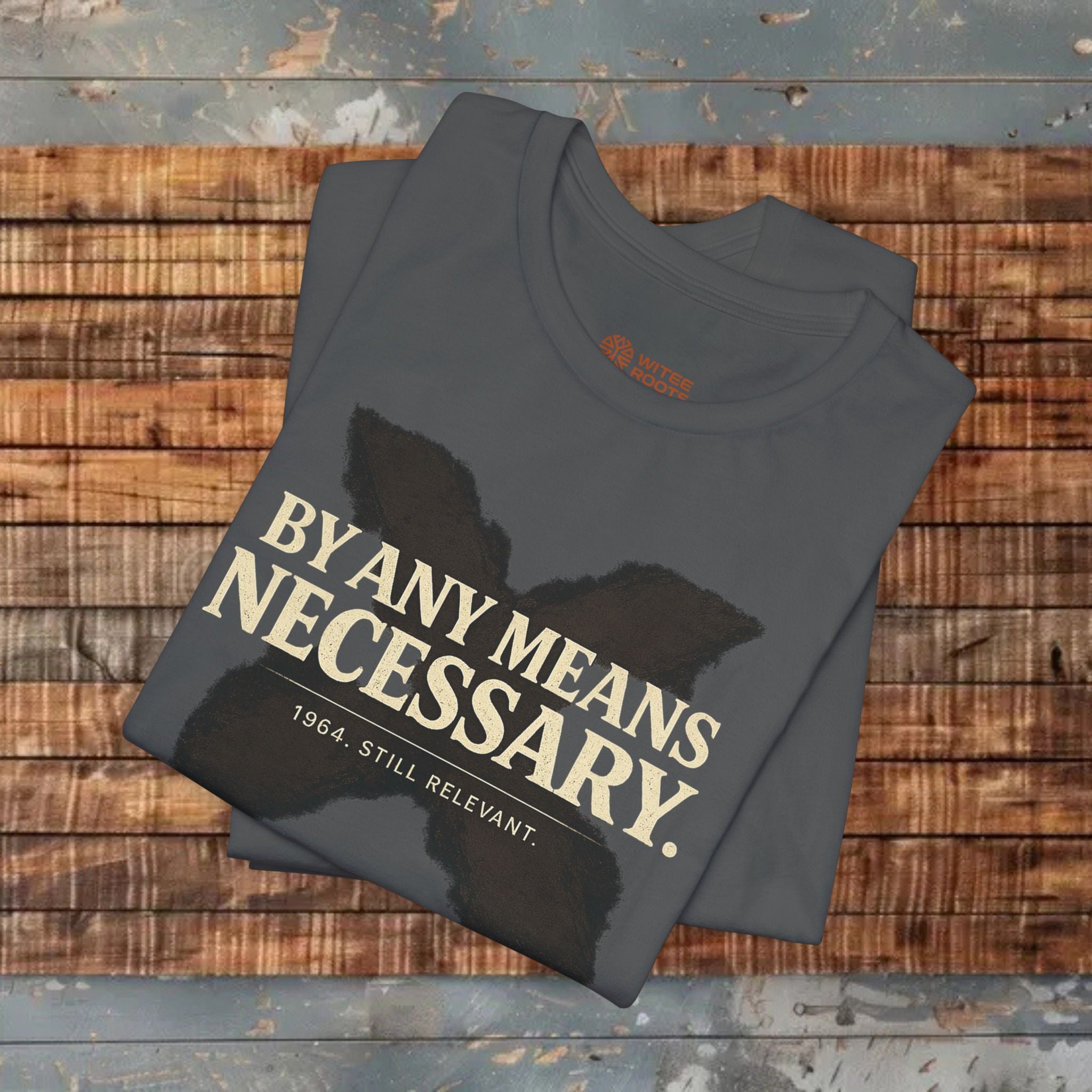 Folded t-shirt with text on a wooden surface
