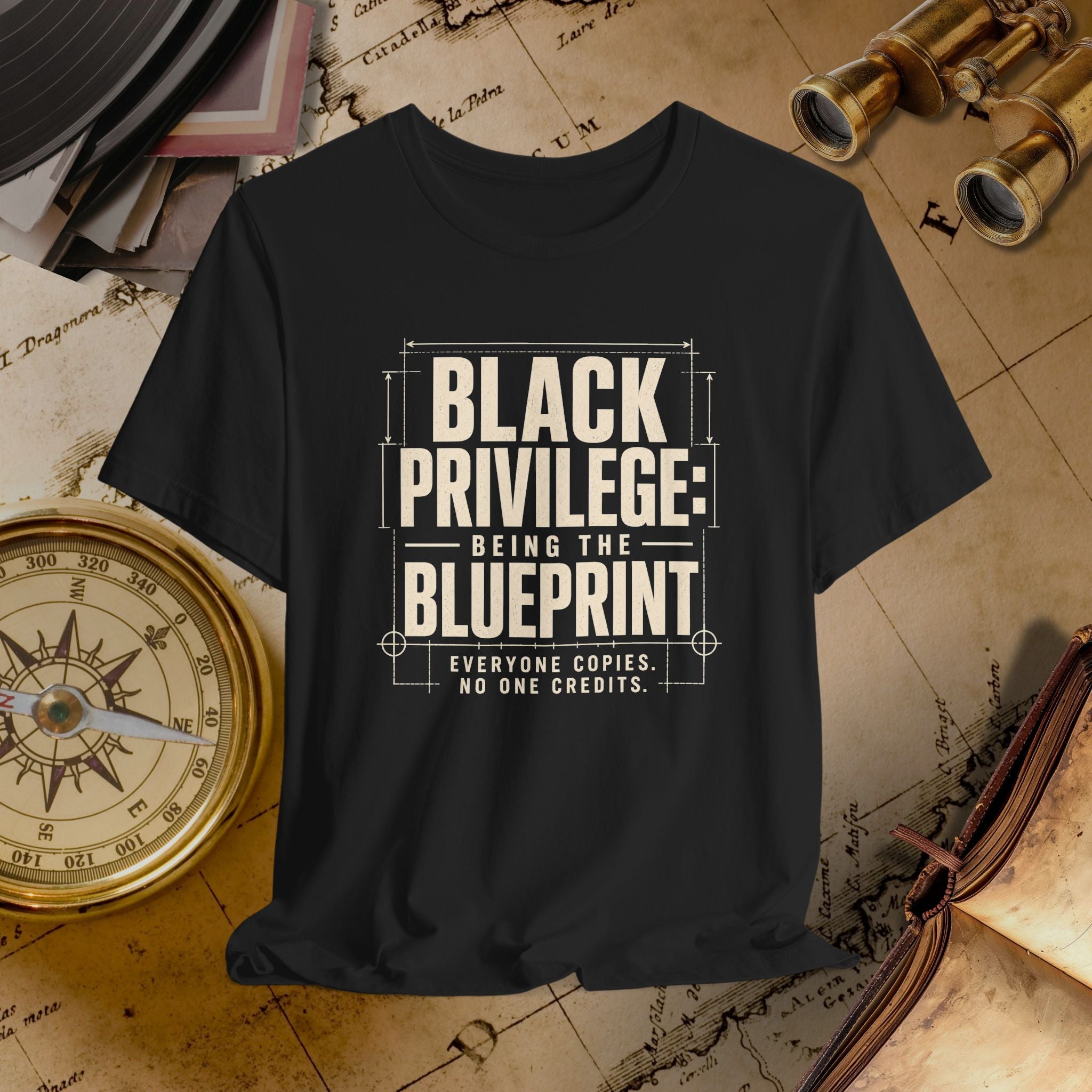 Black t-shirt with 'Black Privilege: Being the Blueprint' text on a vintage map background