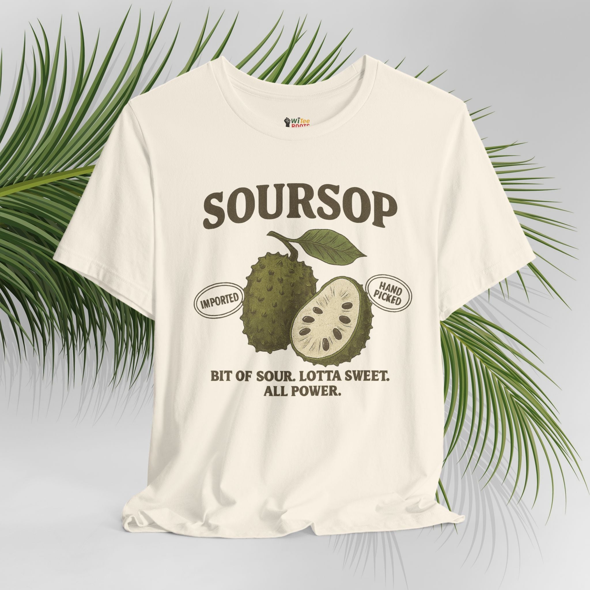 White t-shirt with soursop graphic and text on a light gray background with green leaves.