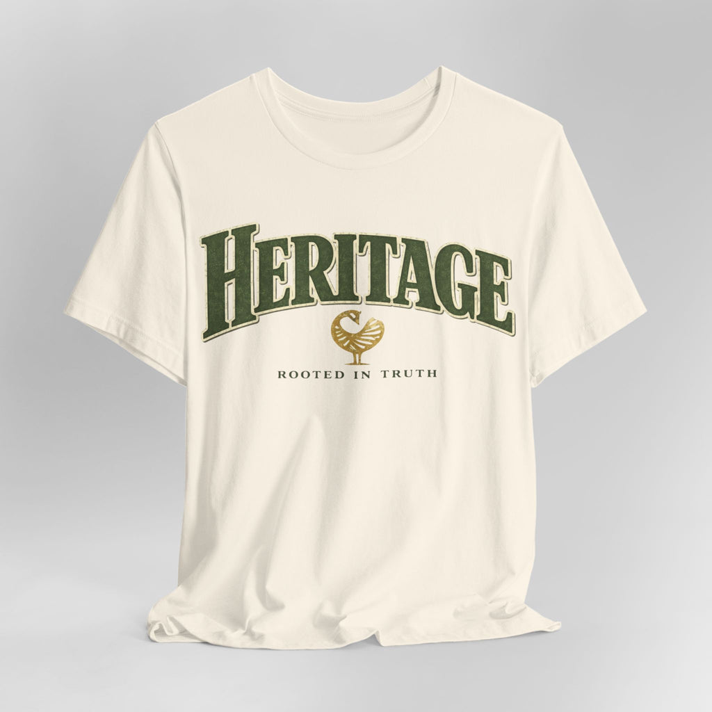 White t-shirt with 'Heritage Rooted in Truth' text and logo on a gray background