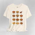 White t-shirt with illustrations of various African dishes and their names on a gray background