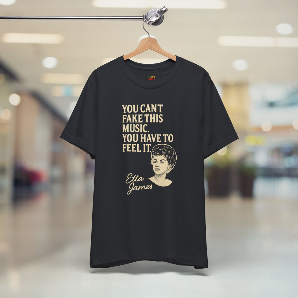 Black t-shirt with Etta James quote on a hanger in a store setting