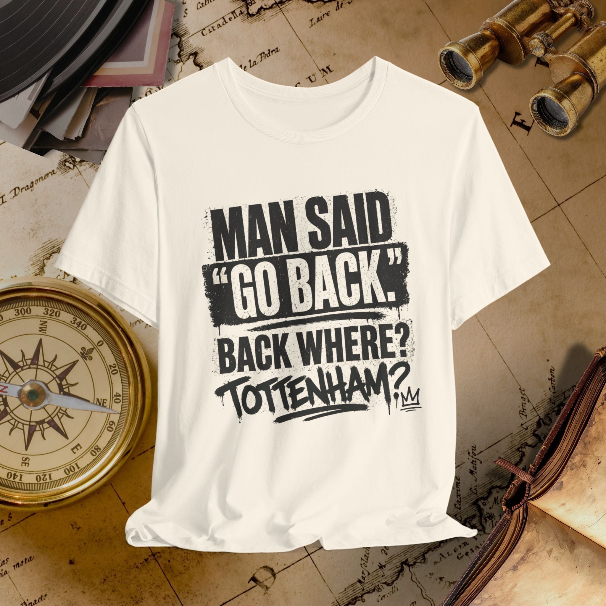 Beige t-shirt with humorous text design on a vintage map background