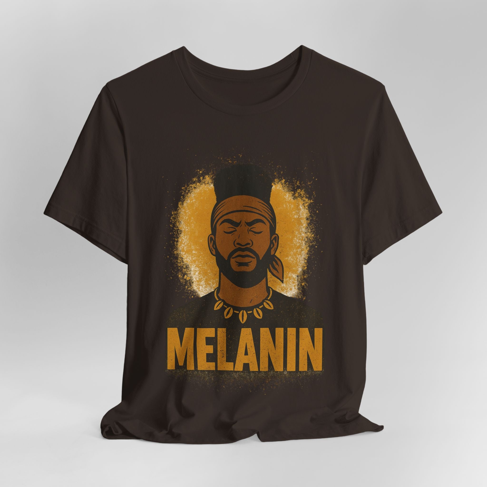 Brown t-shirt with a graphic of a man's face and the word 'Melanin' on a gray background