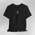 Black t-shirt with orange logo on a light gray background