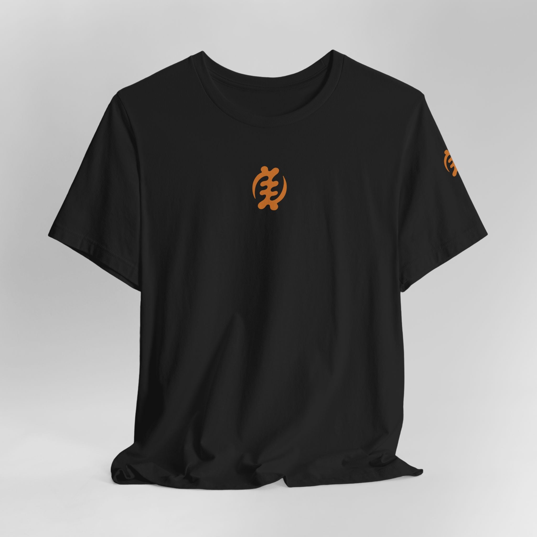 Black t-shirt with orange logo on a light gray background