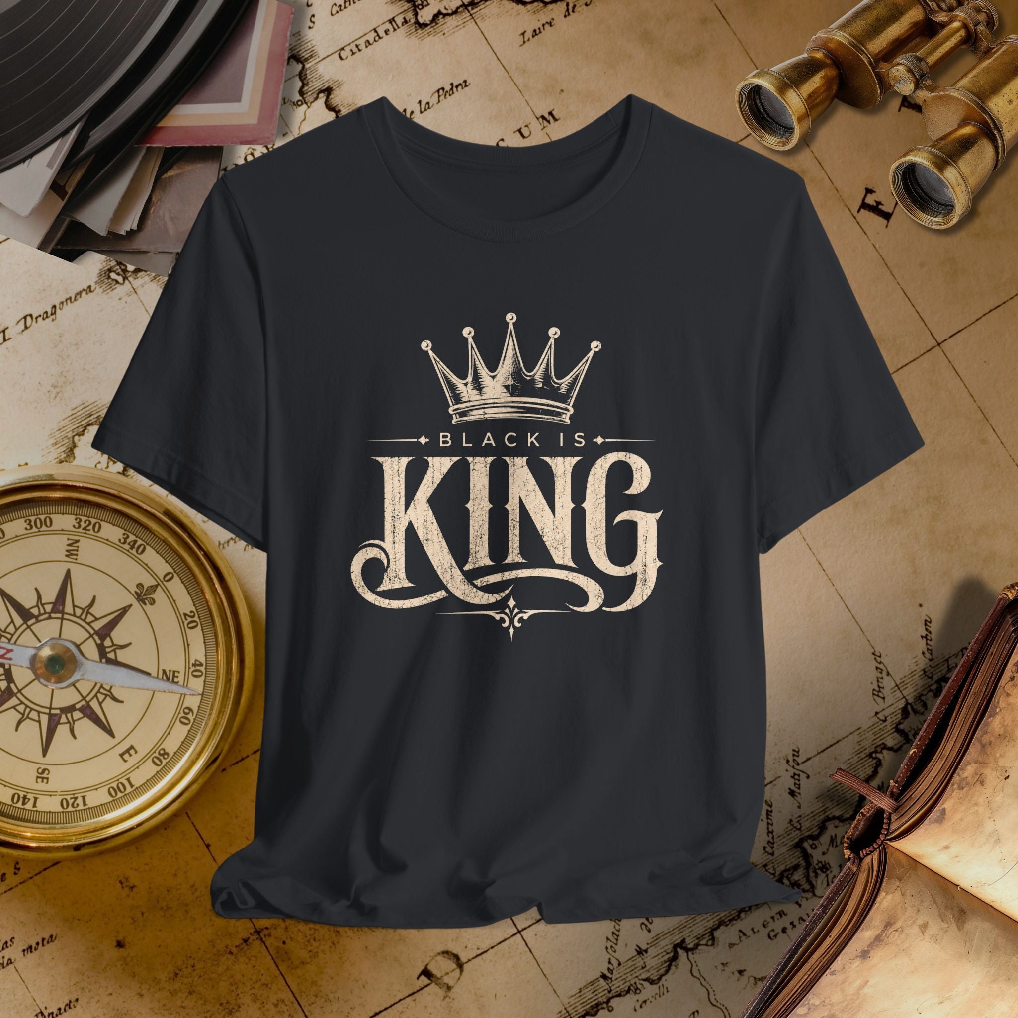 Black t-shirt with 'Black is King' design on a vintage map background